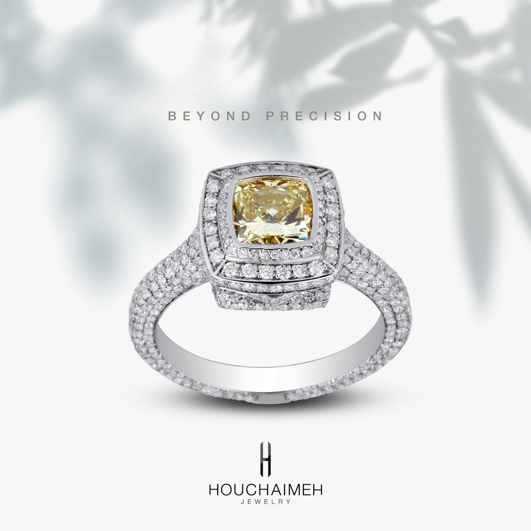 A gold ring includes a beautiful cushion cut center yellow diamond with an incredible assortment of sparkling white diamonds.
